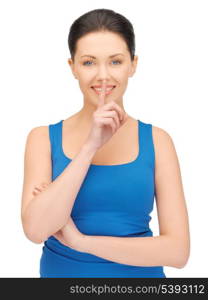 bright picture of beautiful woman making a hush gesture