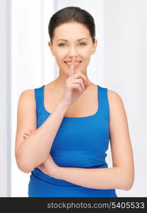 bright picture of beautiful woman making a hush gesture