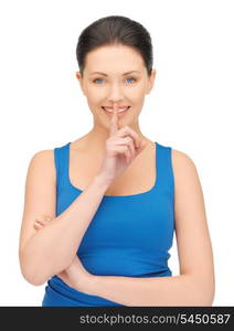 bright picture of beautiful woman making a hush gesture