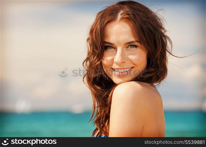 bright picture of beautiful woman on a beach