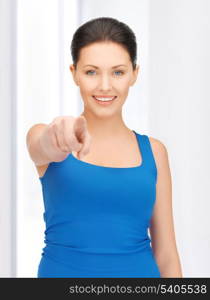 bright picture of beautiful woman pointing her finger