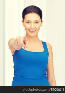 bright picture of beautiful woman pointing her finger. beautiful woman pointing her finger