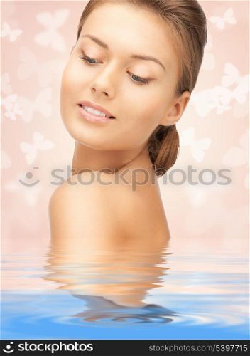 bright picture of beautiful woman with butterflies in water