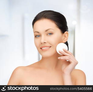 bright picture of beautiful woman with cotton pad