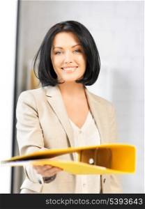 bright picture of beautiful woman with folder