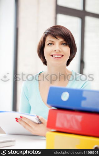 bright picture of beautiful woman with folders