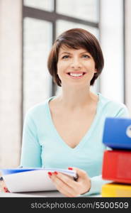 bright picture of beautiful woman with folders