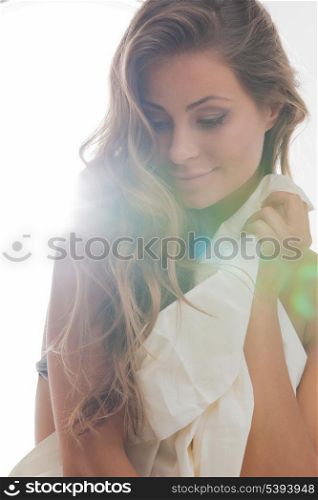 bright picture of beautiful woman with sheet