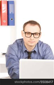 bright picture of businessman with laptop computer in office