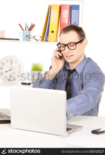 bright picture of businessman with laptop computer in office