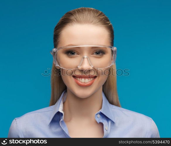 bright picture of businesswoman in protective glasses