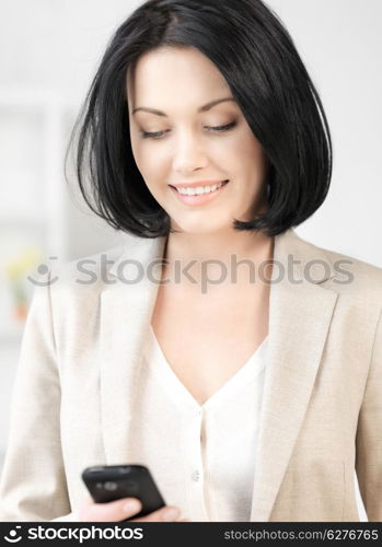 bright picture of businesswoman with cell phone