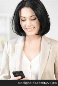 bright picture of businesswoman with cell phone