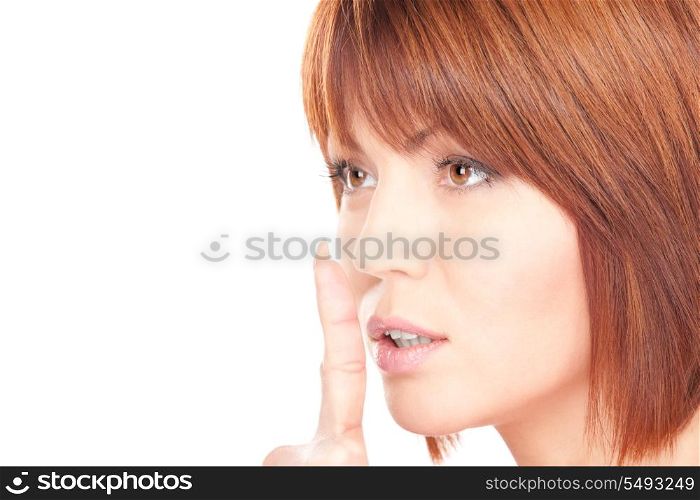 bright picture of businesswoman with finger on lips&#xA;