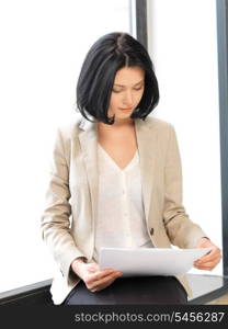bright picture of calm woman with documents