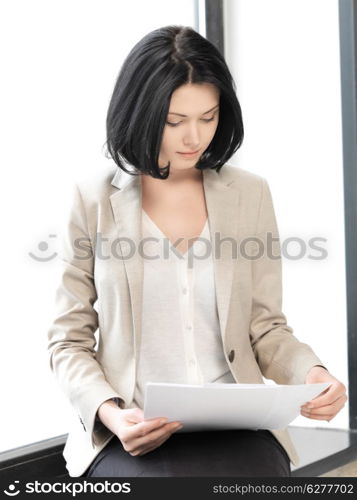 bright picture of calm woman with documents