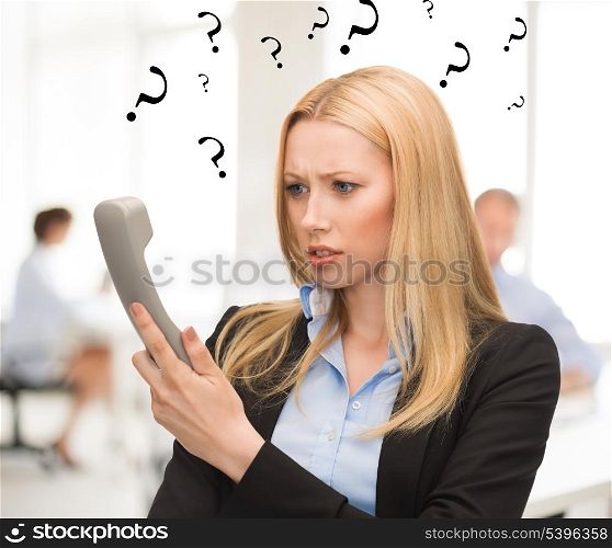 bright picture of confused woman with phone in office