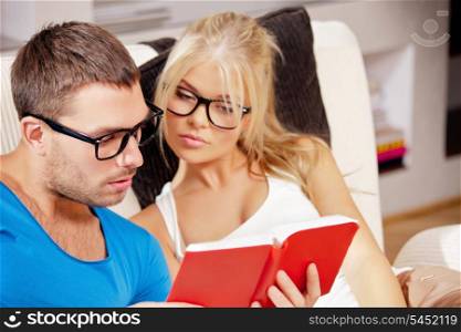 bright picture of couple at home with book