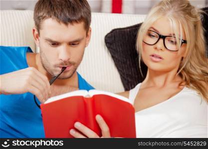 bright picture of couple at home with book