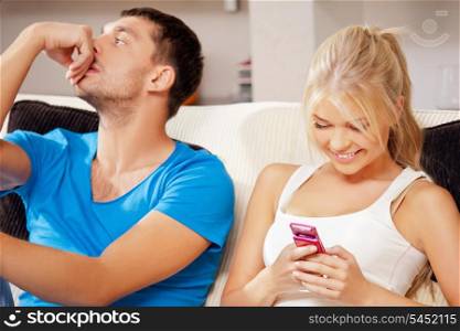 bright picture of couple at home with cellphone