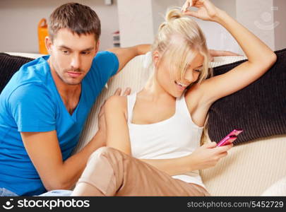 bright picture of couple at home with cellphone