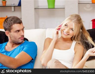 bright picture of couple with cellphone (focus on woman)
