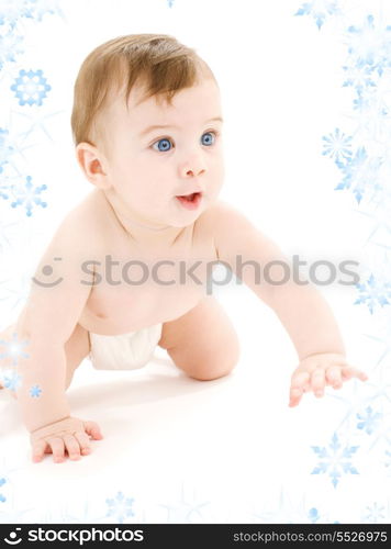 bright picture of crawling baby boy in diaper