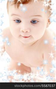 bright picture of crawling baby boy with snowflakes