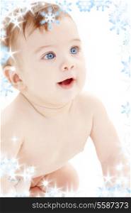 bright picture of crawling baby boy with snowflakes
