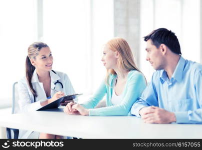 bright picture of doctor with patients in cabinet. doctor with patients in cabinet