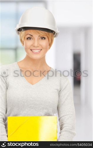 bright picture of female contractor in helmet