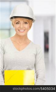 bright picture of female contractor in helmet