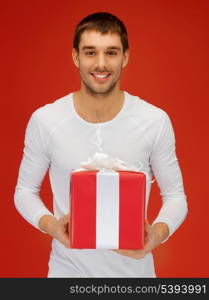 bright picture of handsome man with a gift .