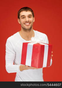 bright picture of handsome man with a gift .