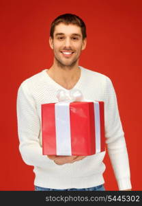 bright picture of handsome man with a gift .