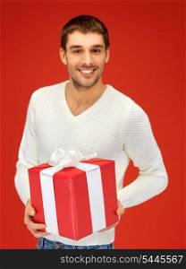 bright picture of handsome man with a gift .