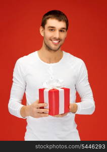 bright picture of handsome man with a gift .