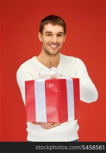 bright picture of handsome man with a gift .