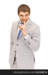 bright picture of handsome man with finger on lips