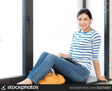 bright picture of happy and smiling teenage girl with laptop