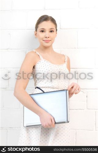 bright picture of happy and smiling teenage girl with laptop