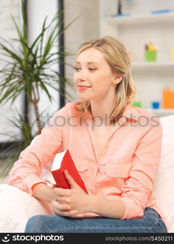 bright picture of happy and smiling woman with book..