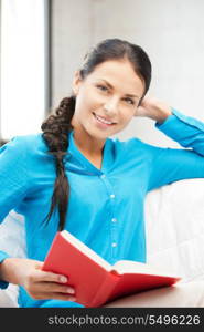 bright picture of happy and smiling woman with book