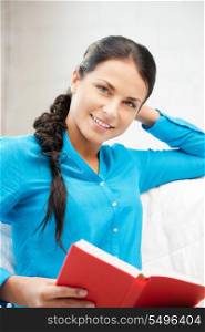 bright picture of happy and smiling woman with book