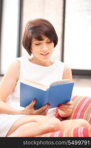 bright picture of happy and smiling woman with book