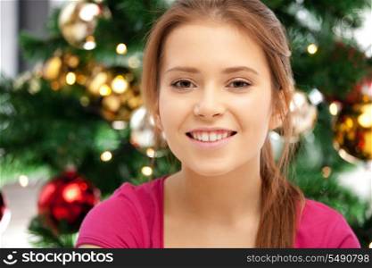 bright picture of happy and smiling woman with christmas tree