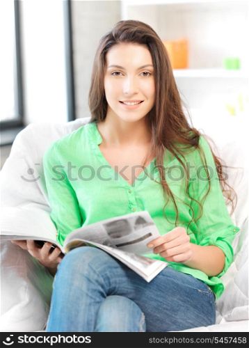 bright picture of happy and smiling woman with magazine