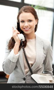 bright picture of happy businesswoman with phone