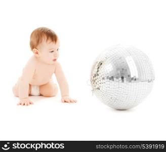 bright picture of happy child playing with disco ball