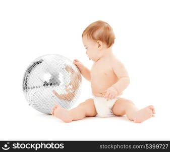 bright picture of happy child playing with disco ball